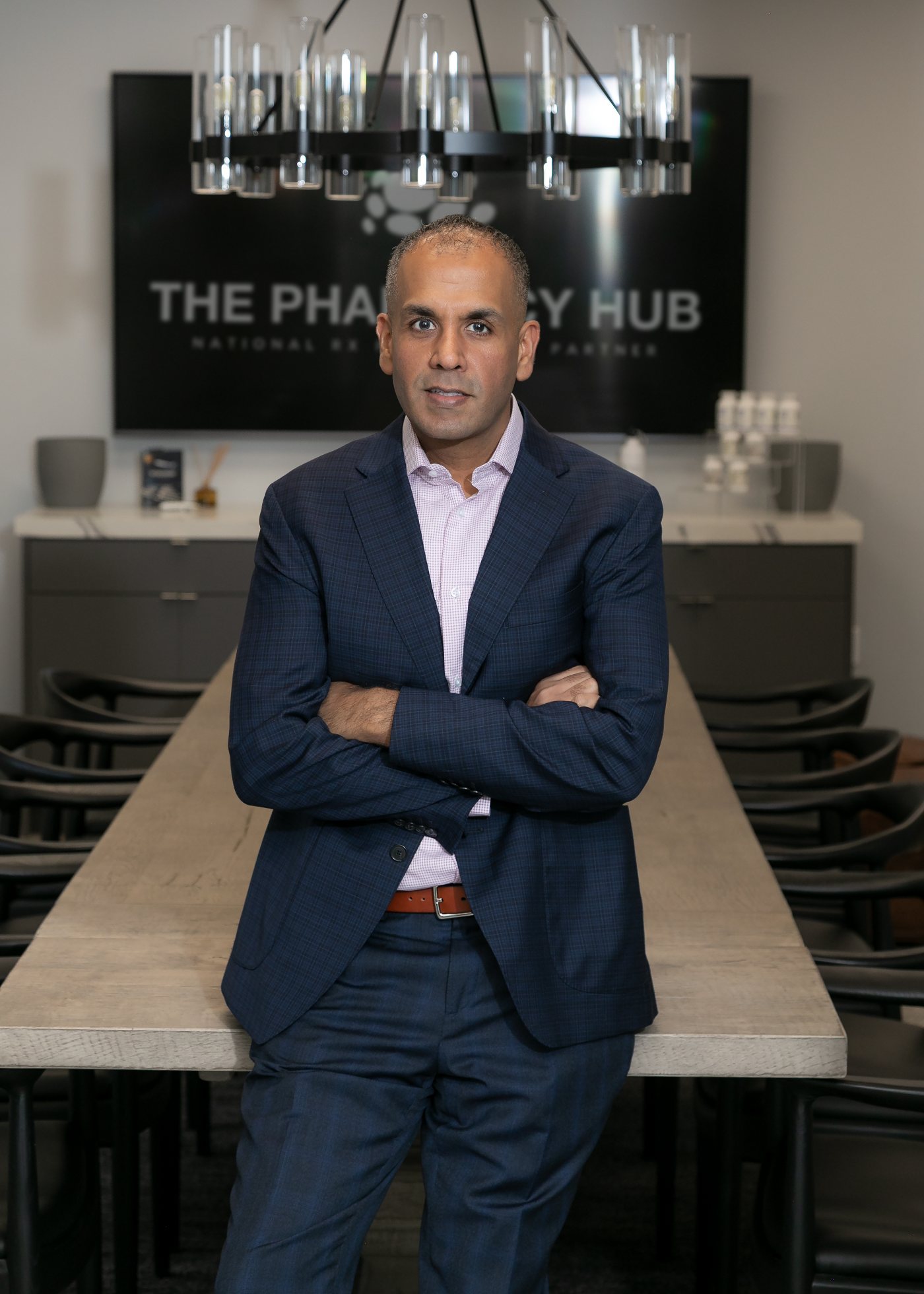 Bains Consulting leadership in the lobby of a pharmacy operations facility