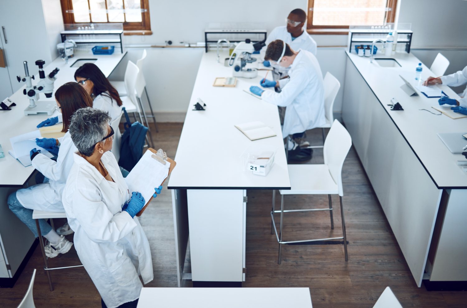 Pharmacy professionals in a hands-on compounding training session